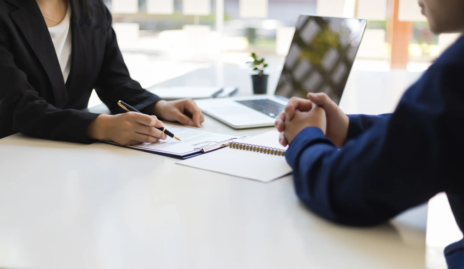 Businesswoman reviewing document with client.