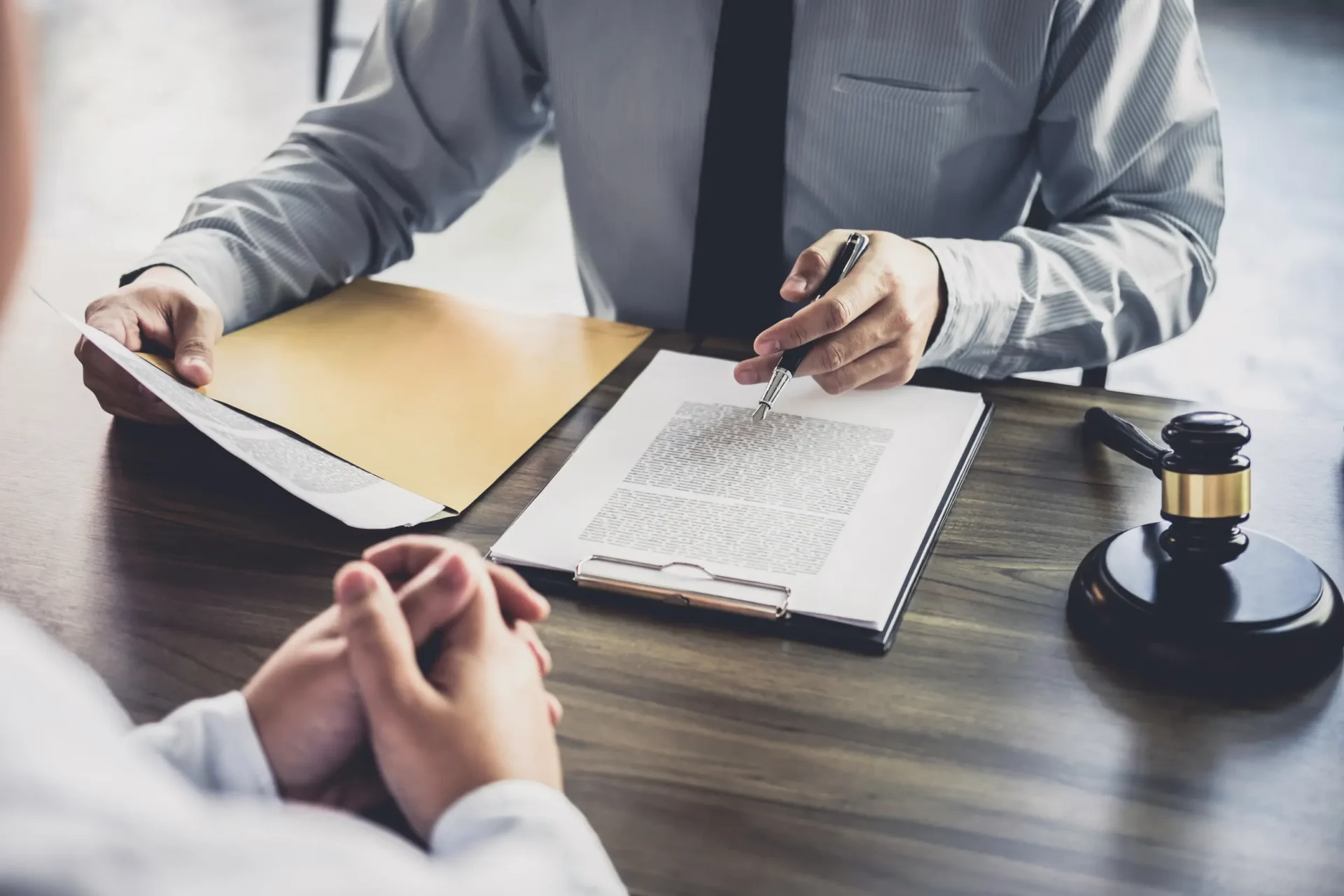 Lawyer reviewing documents with client.