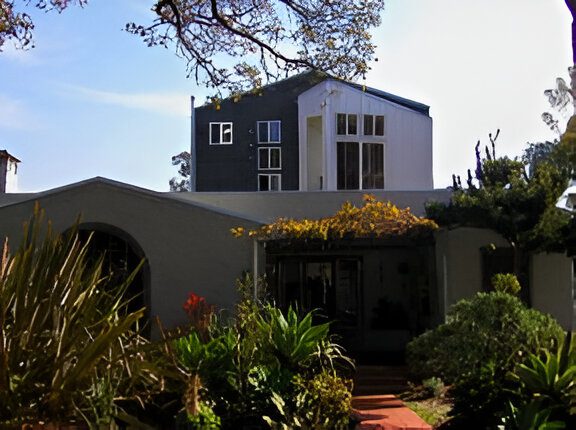 Modern house with landscaping and walkway.